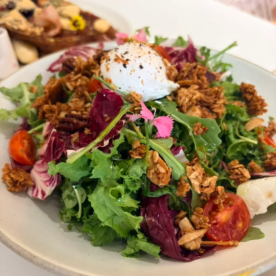 House salad topped with berries