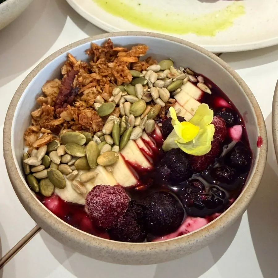 Yogurt bowl topped with granola and fruit