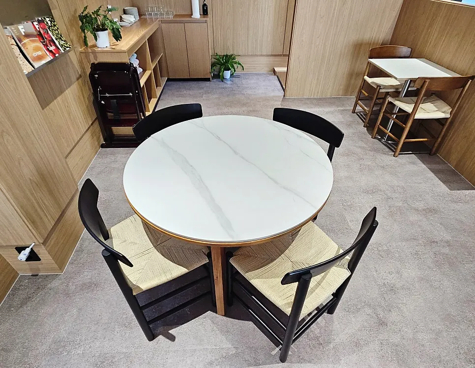 Wide table and chairs on the 2nd floor of Famous Benny