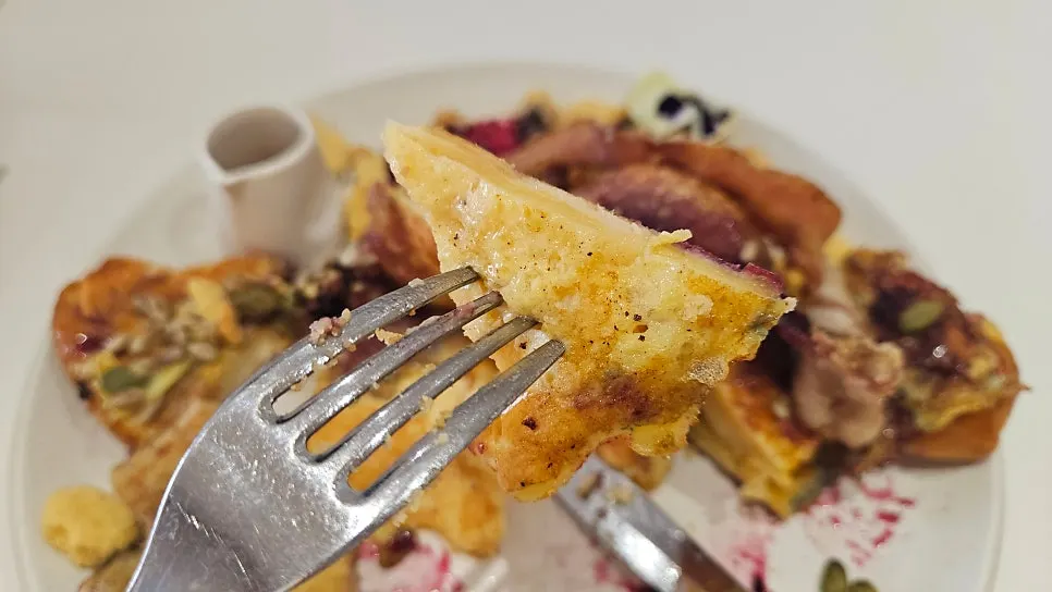 A cut piece of Famous Benny's French toast