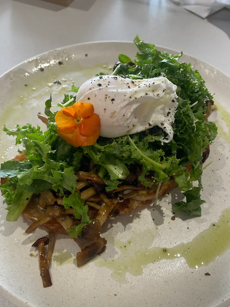 Grilled mushroom toast topped with flowers