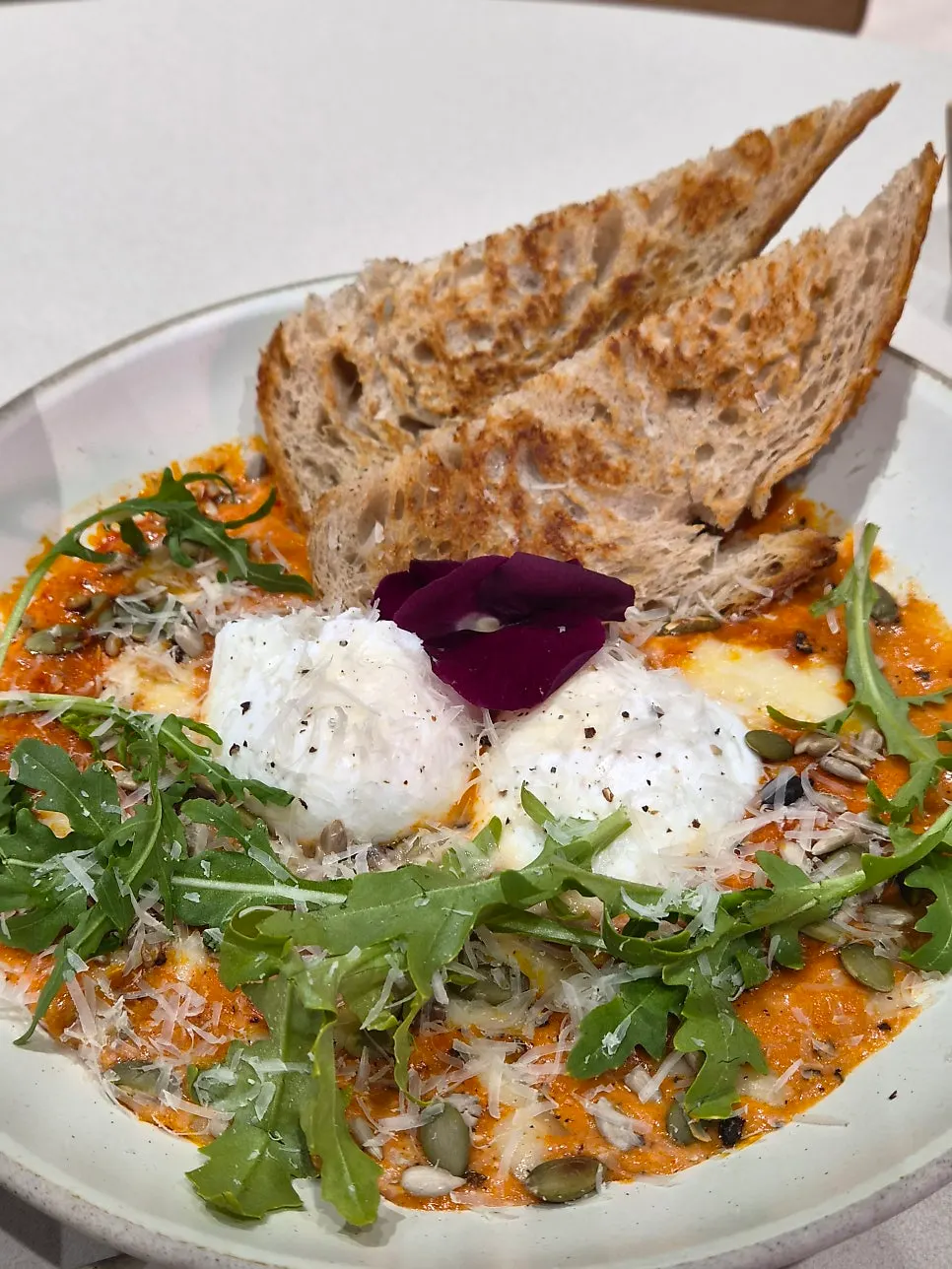 Eggs in Hell with a tomato sauce base