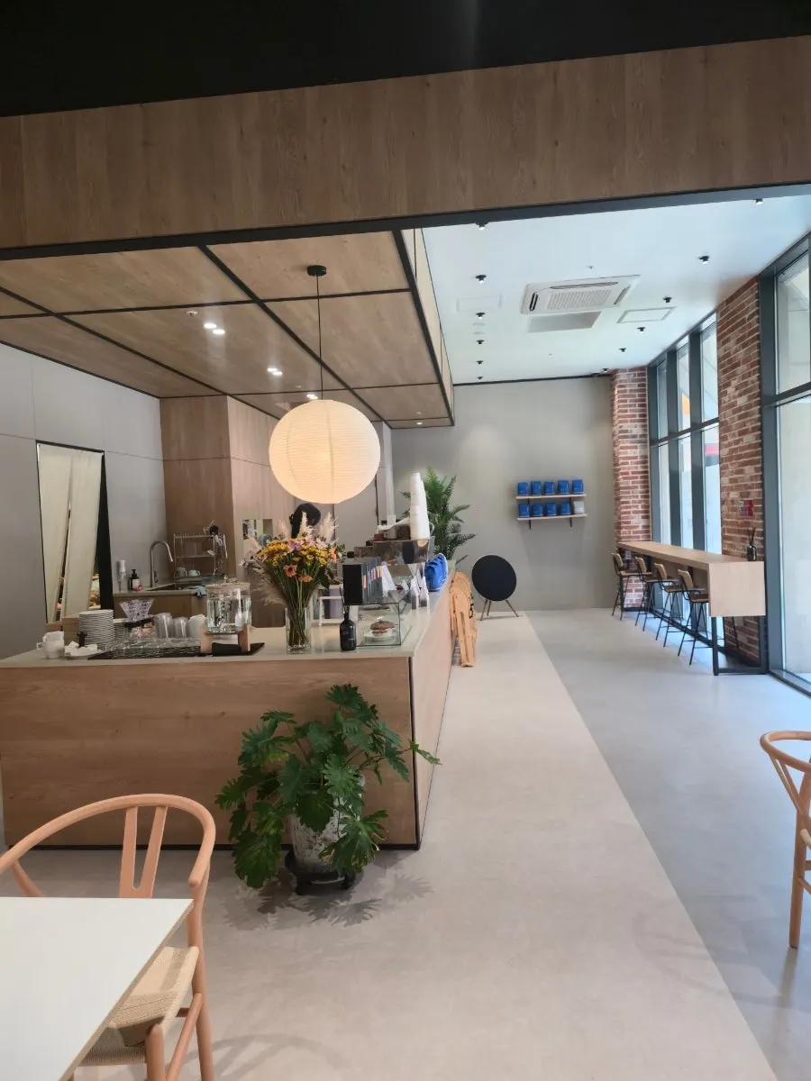 White and wood-tone interior laid out in a single line