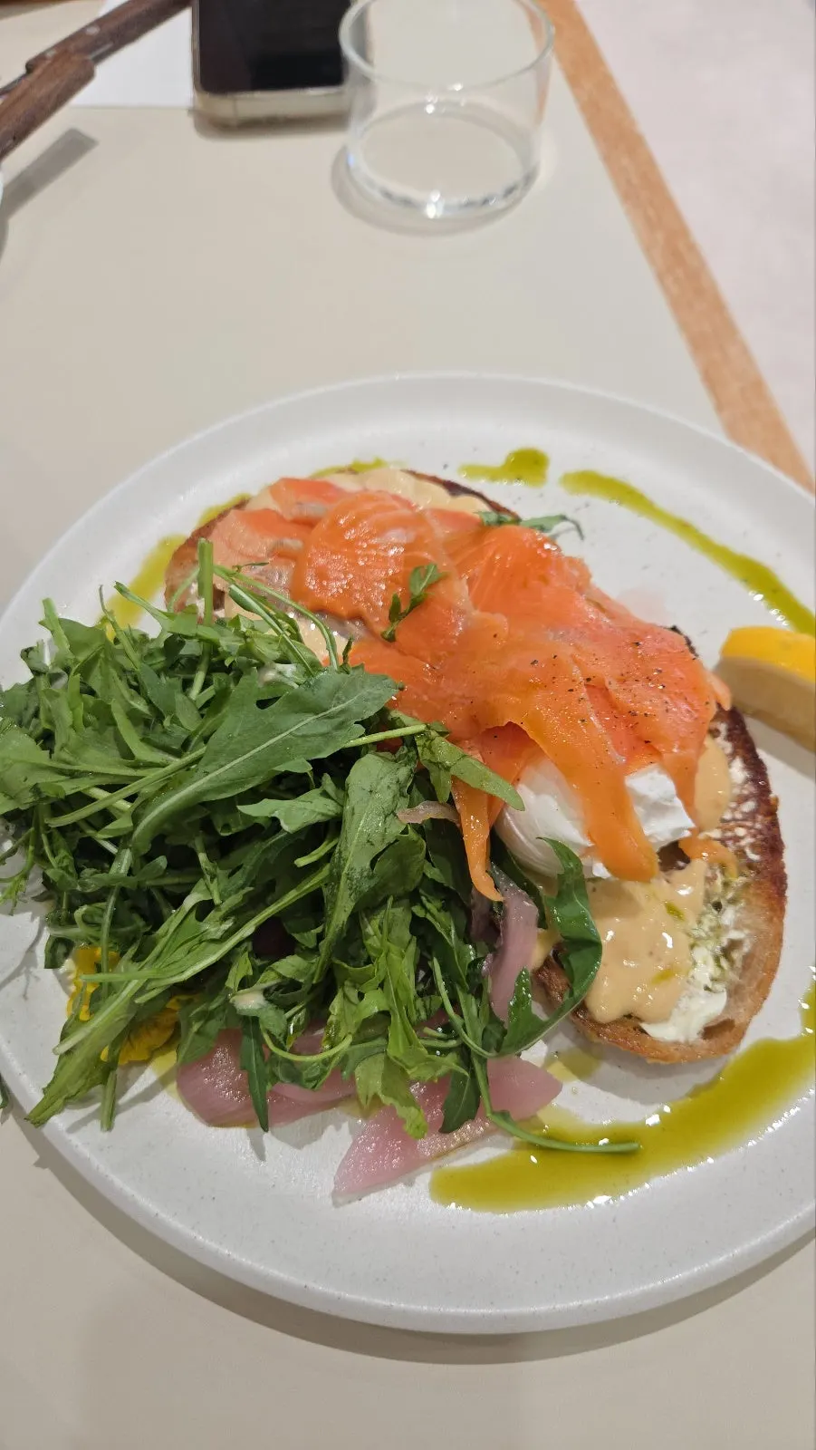 Smoked salmon toast taken apart, eaten with arugula