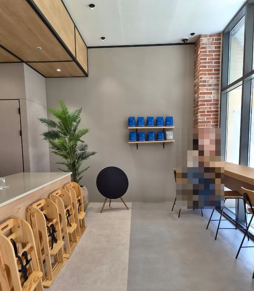Café interior with high chairs and window bar table