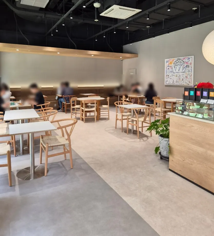 Café interior in wood and white tones