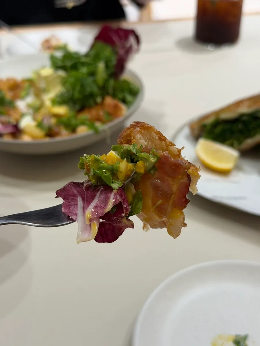 Cutting the brunch dish with a knife to share