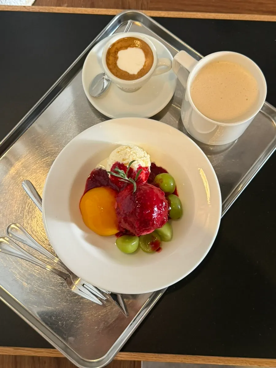 Peach melba topped with peach and shine muscat grapes