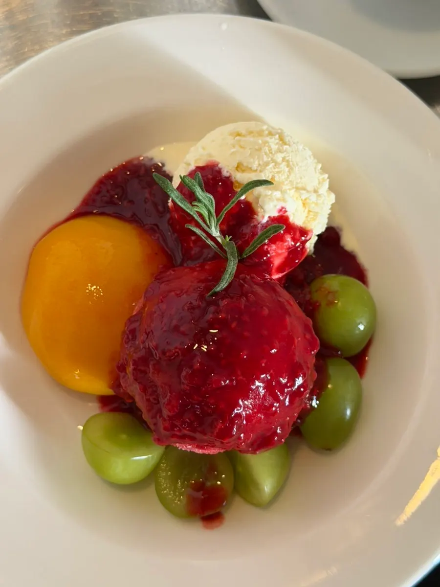 Close-up of peach melba with ice cream and fruit