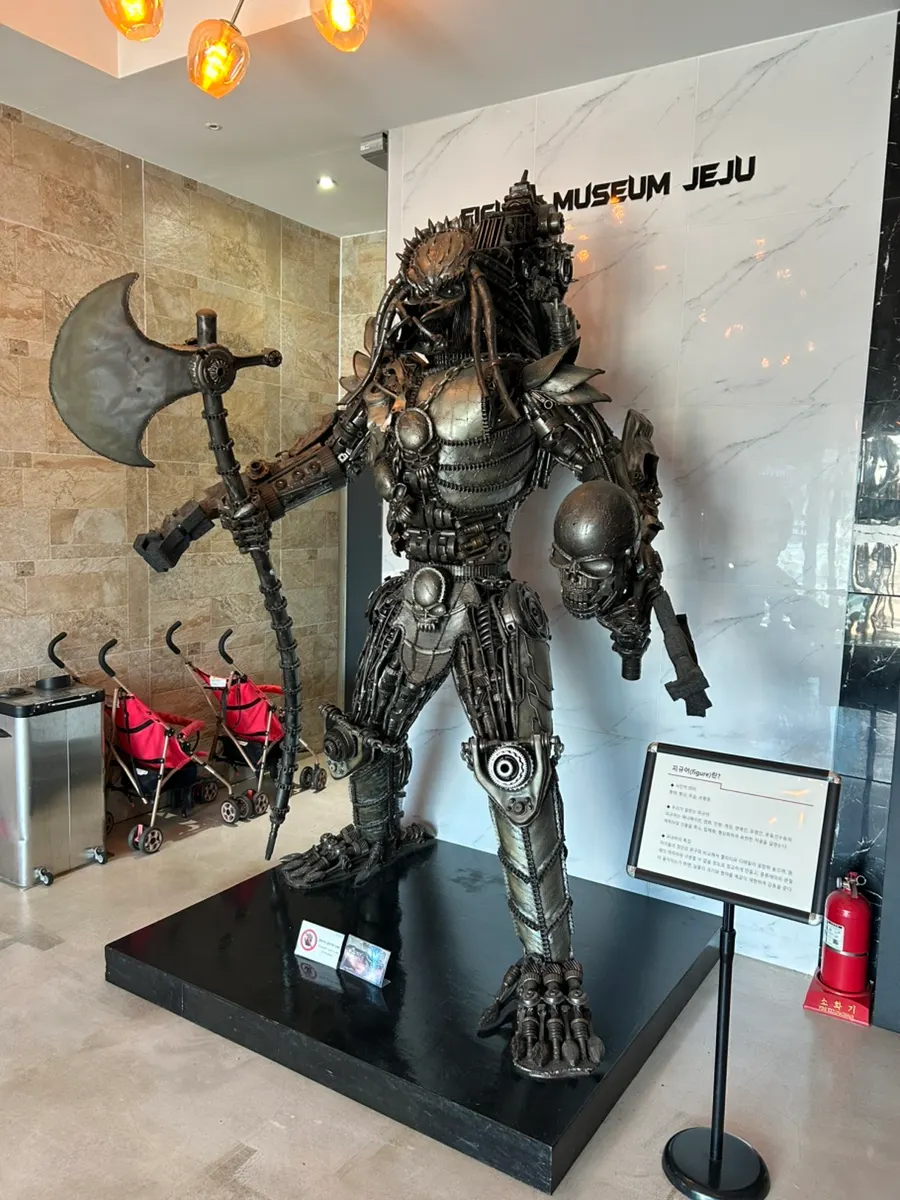 Life-size large figures visible right after entering