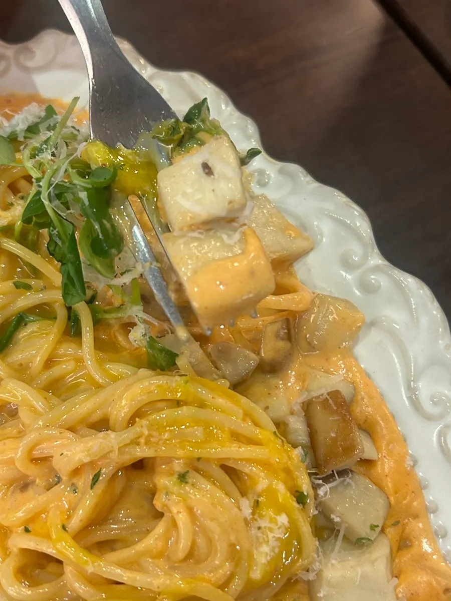 Close-up of plump shrimp on the rosé pasta