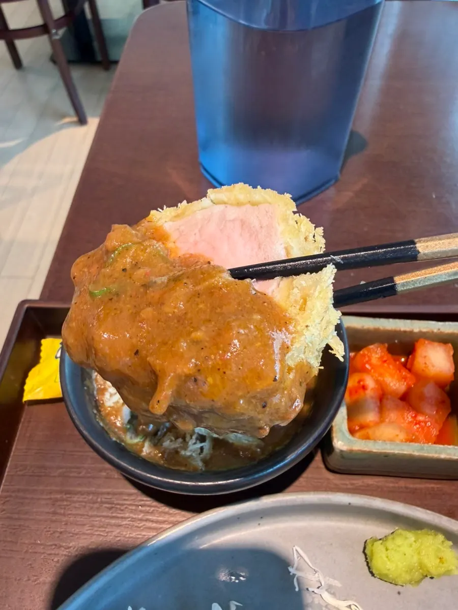 Tenderloin katsu dipped in the curry side