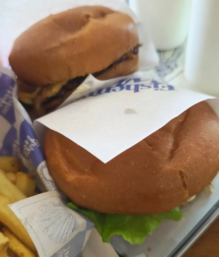 Handmade burger wrapper with blue lettering on white background