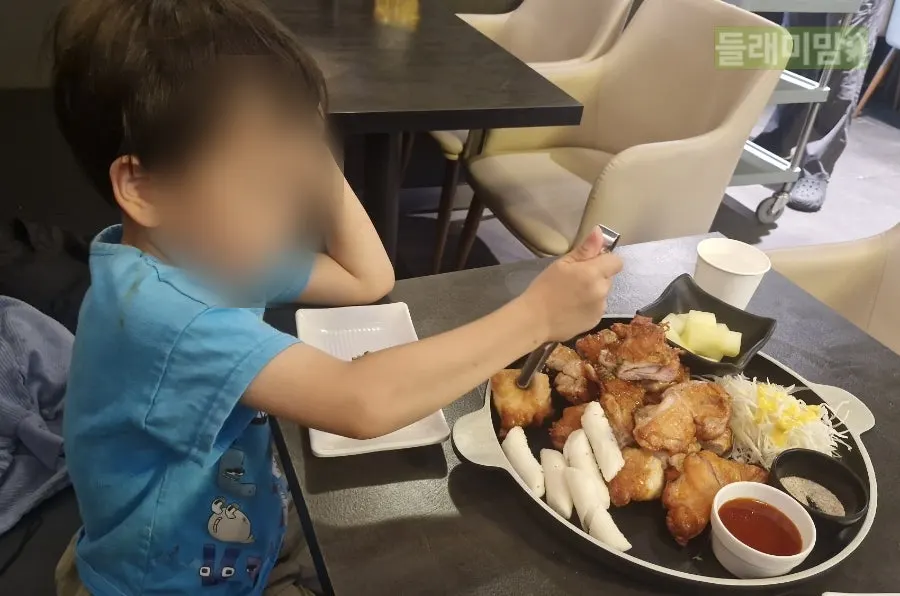 A child's plate with pieces of boneless chicken