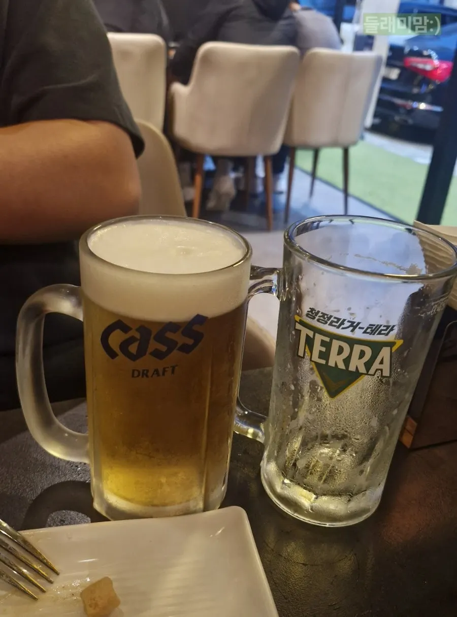 An additional glass of Cass draft beer ordered