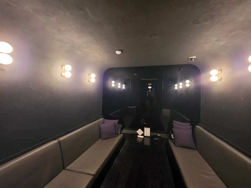 Interior view showing central bar seats and stage