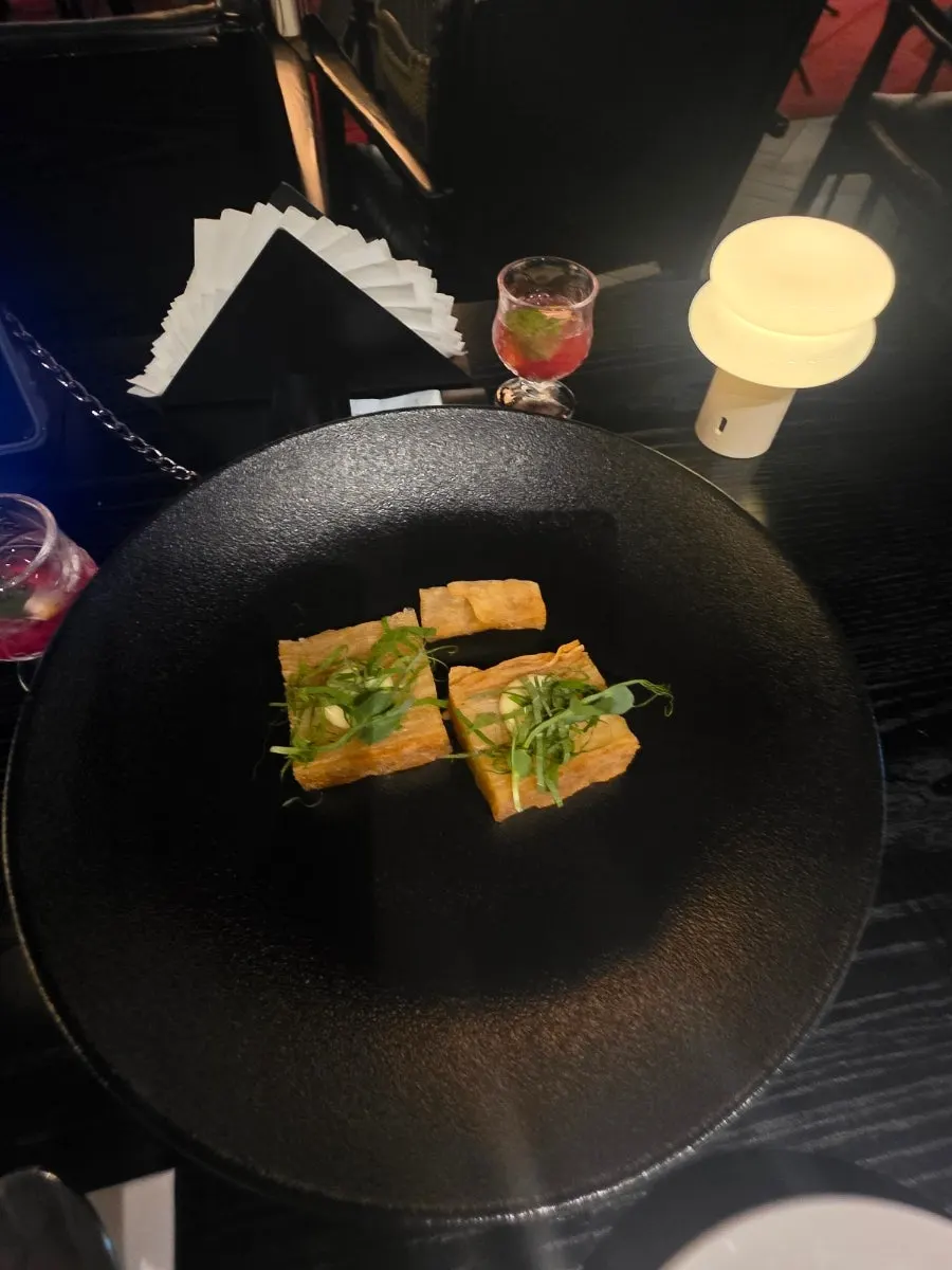 A glass of non-alcoholic aperitif that was ordered