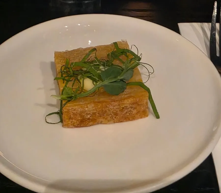 Amuse-bouche of thin potato layers fried crisp