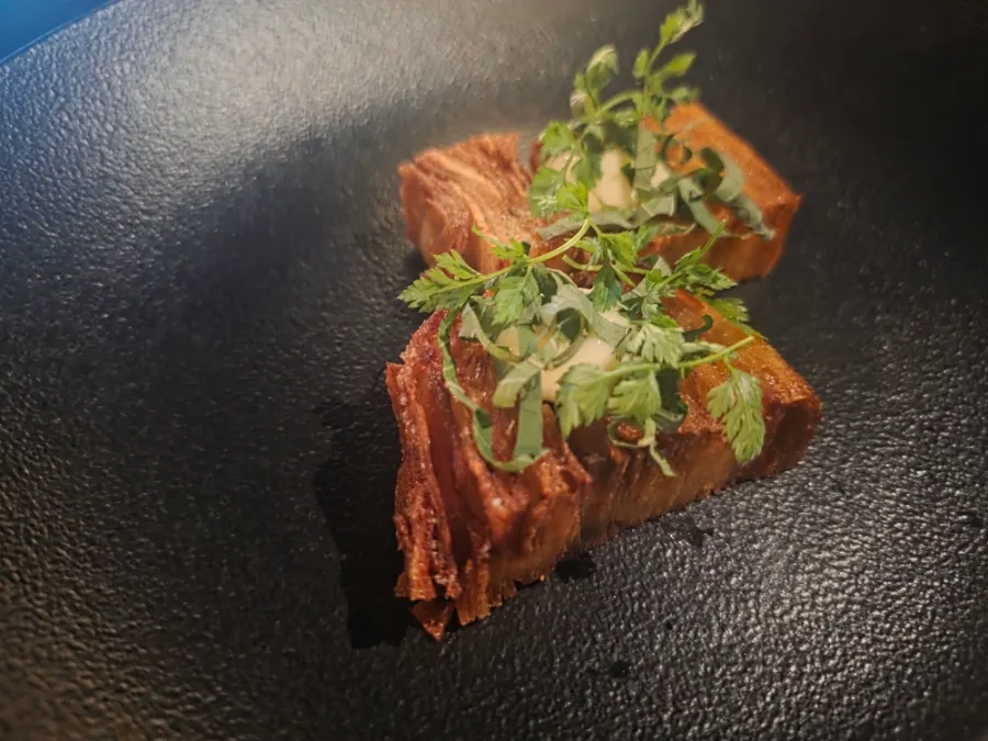 Plating of a small dish early in the course