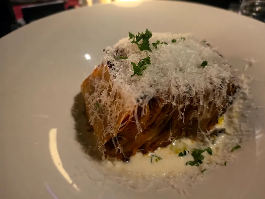 Lasagna topped with white truffle cream