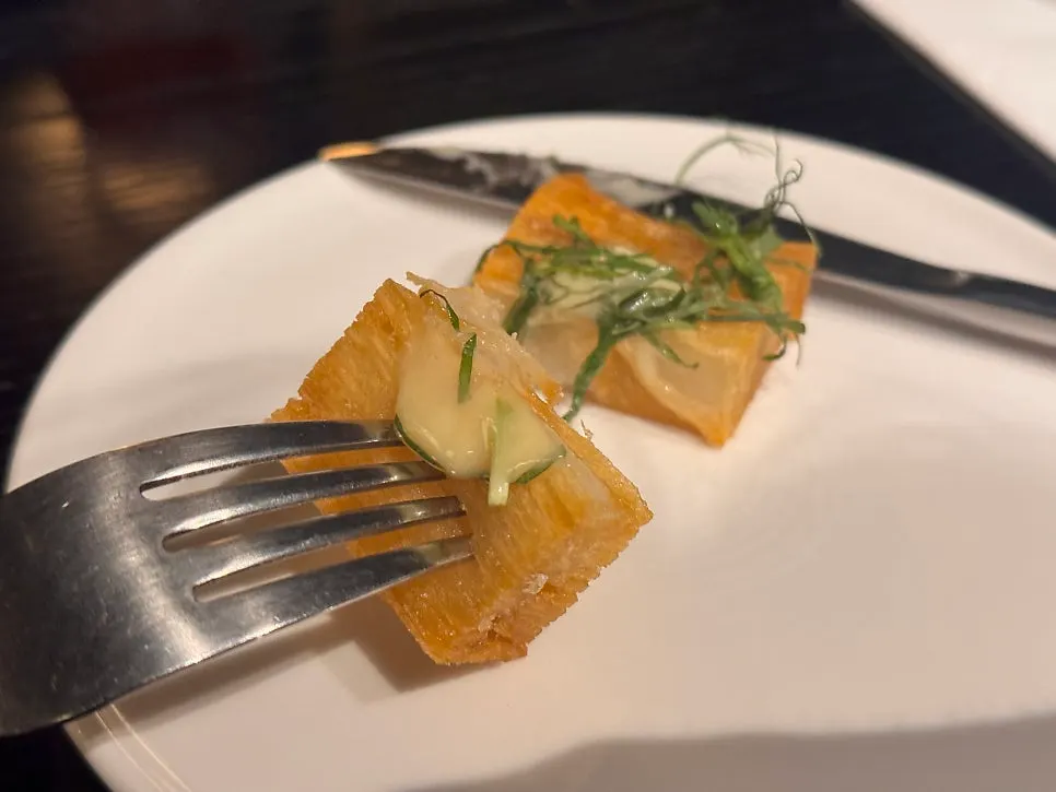 Crispy potato dish made of thinly stacked, fried layers