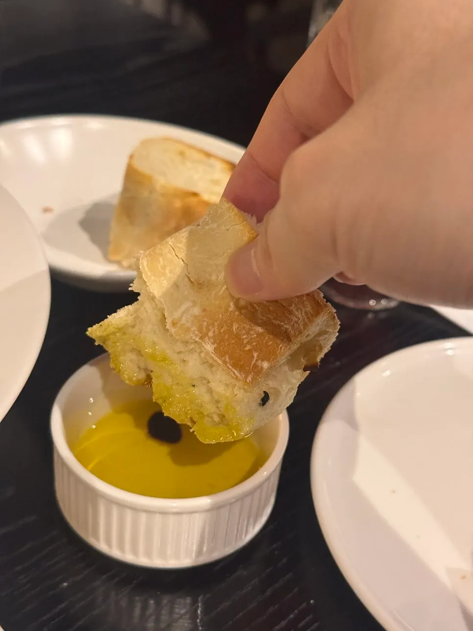 Warm focaccia bread served with balsamic olive oil