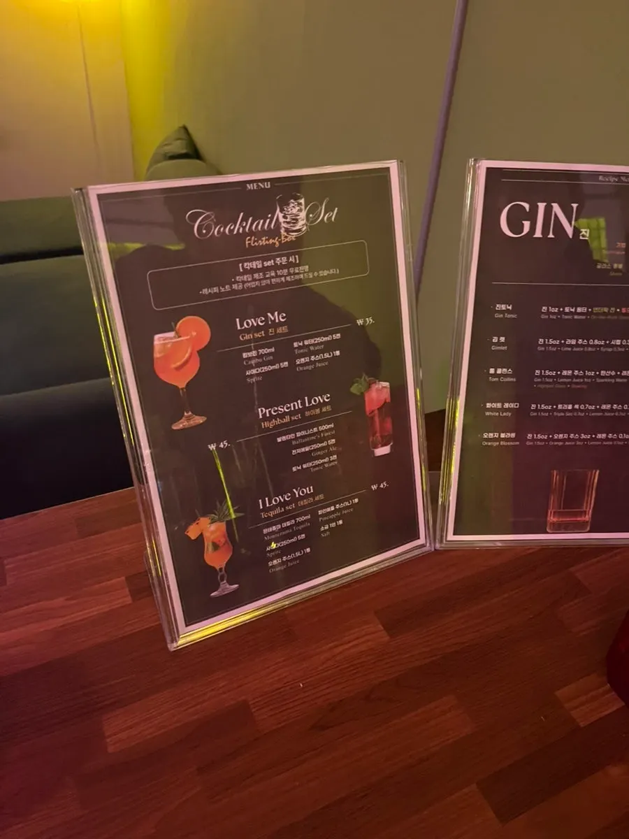 Cocktail ingredients including gin and orange juice