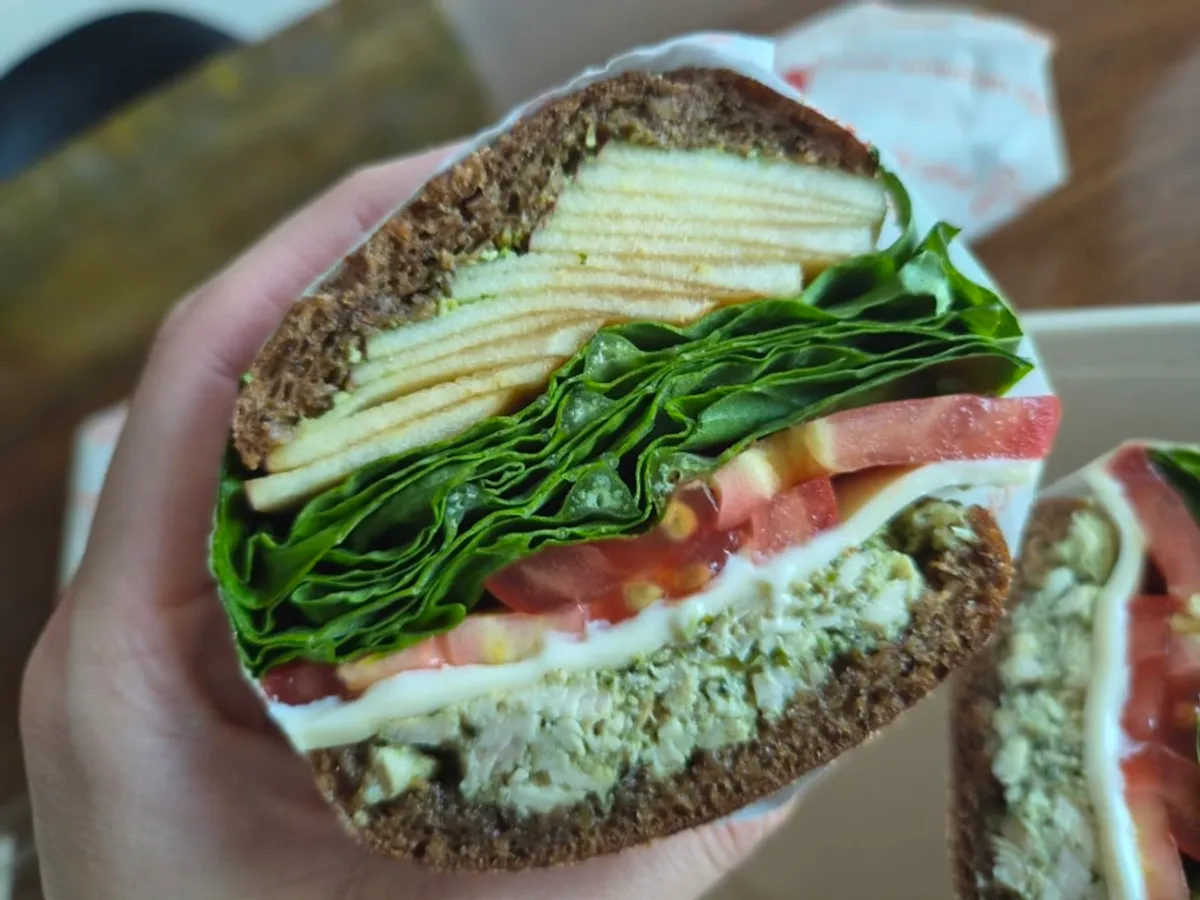 Cross-section of the basil chicken apple bun made with rye bread
