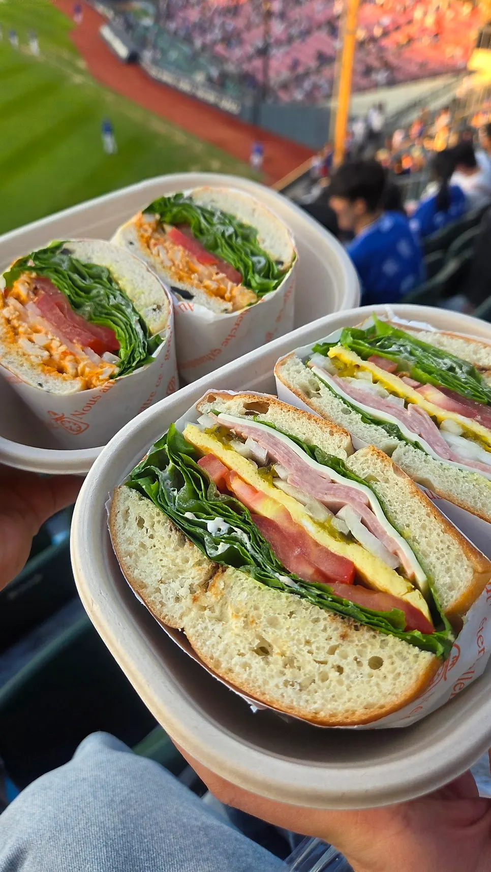 Eating sandwiches while watching the baseball game