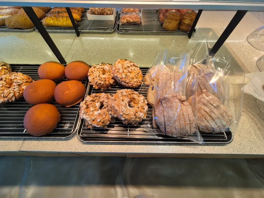 Egg tarts and canelés on display