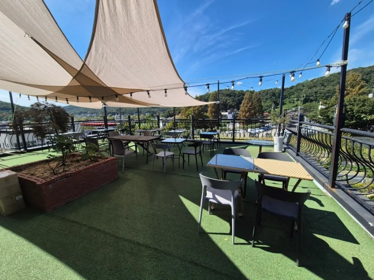 View of Mulwang Reservoir and mountains from Flowerpot Cafe's third-floor outdoor terrace
