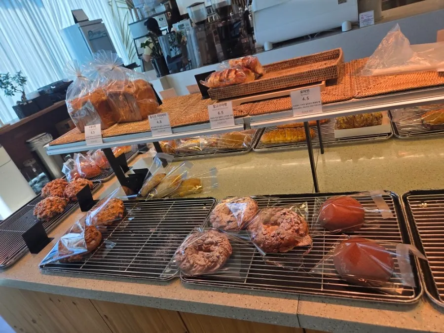 Display case with cookies, pound cakes and canelés