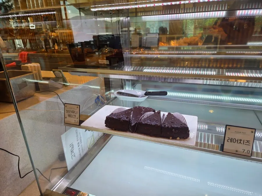 Fruit croissants, mont blanc, and roll cake on display