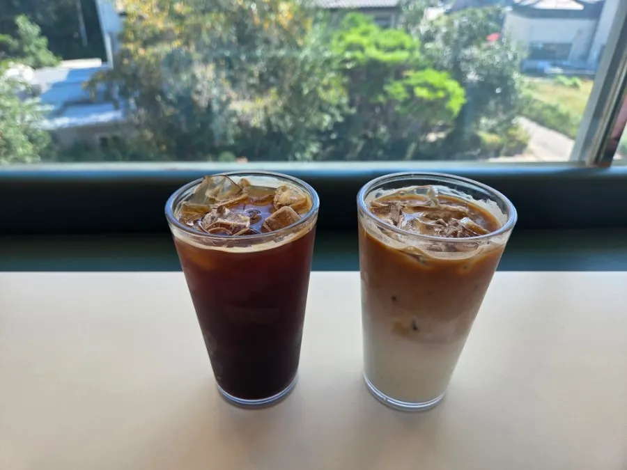 Fig croissant, egg tart and iced drinks set on the table