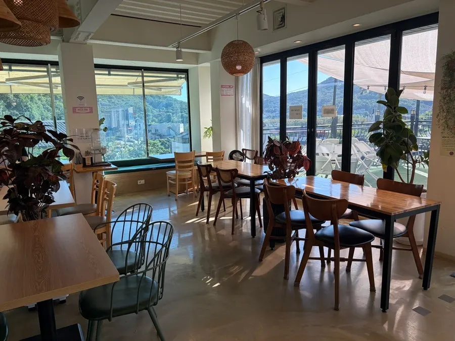 1st floor seating area filled with potted plants