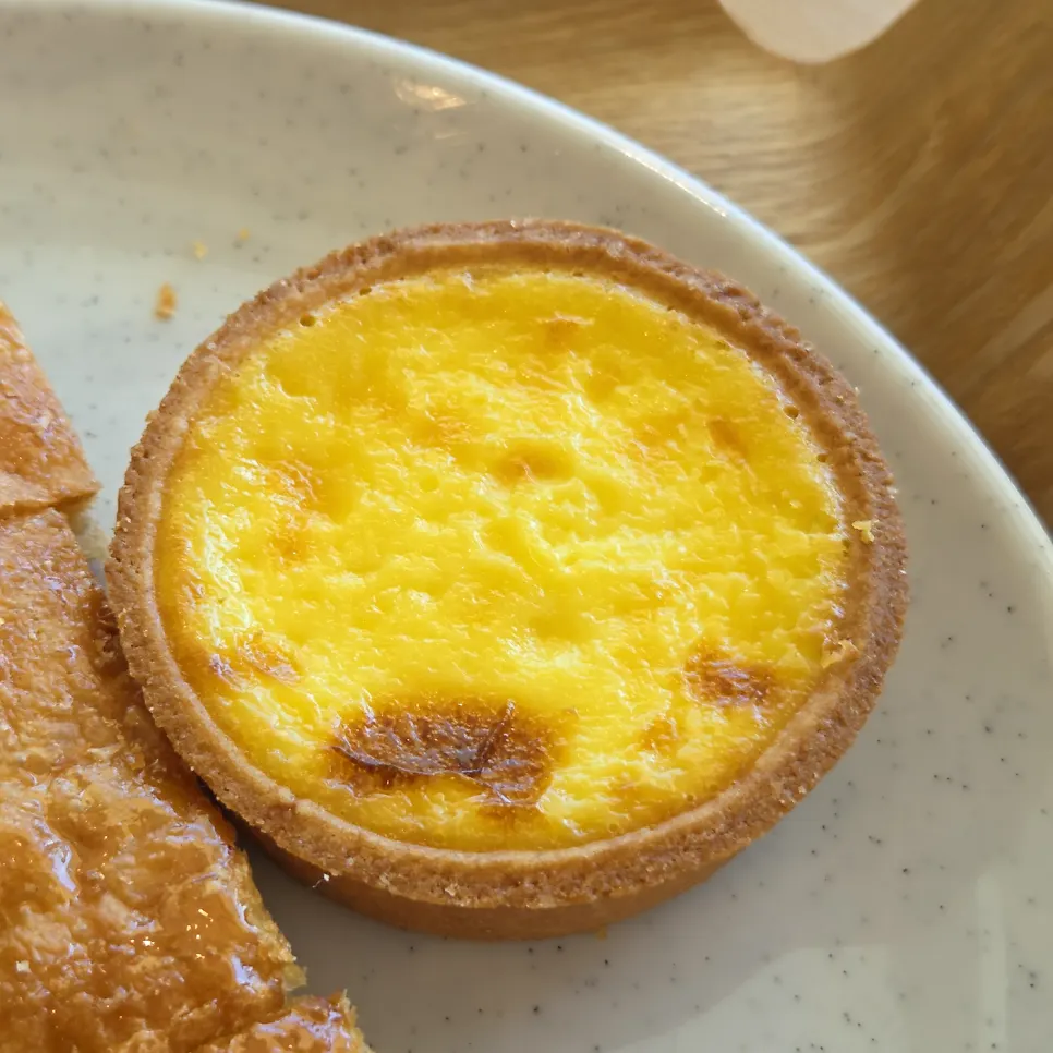 Flowerpot Cafe's egg tart with egg filling visible