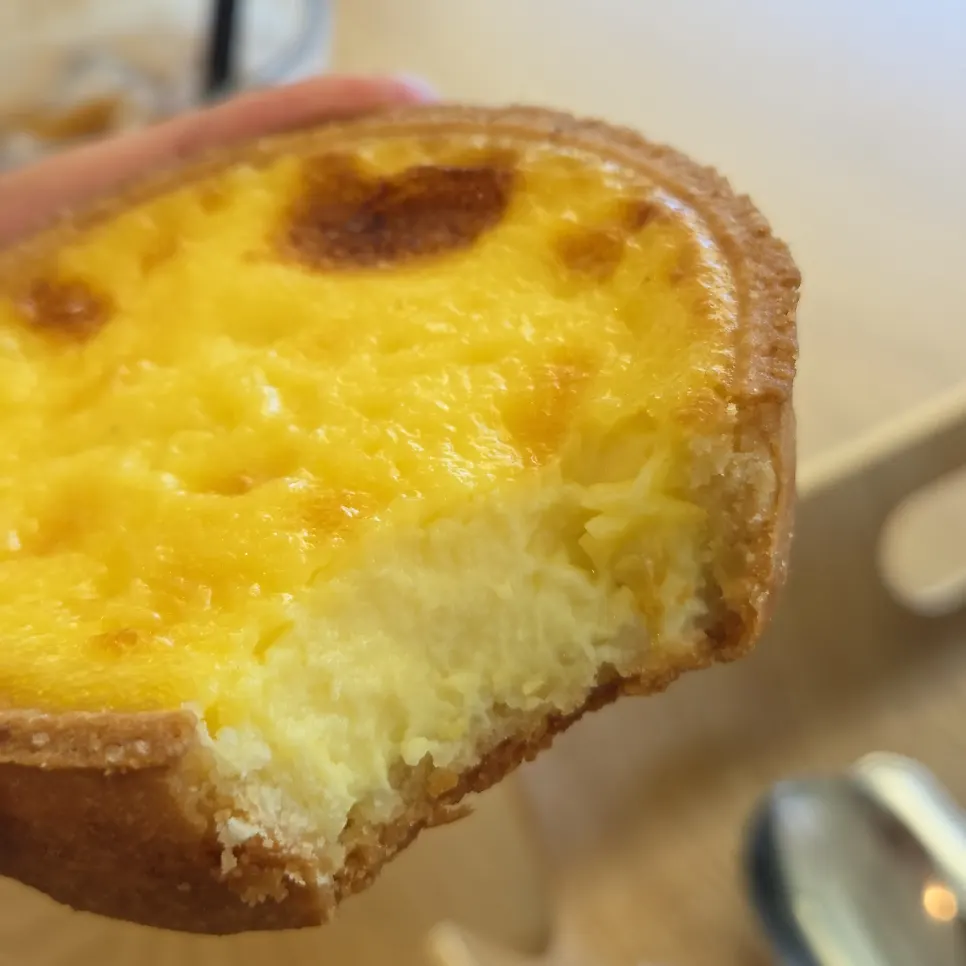 Egg tart showing the tart shell and egg filling
