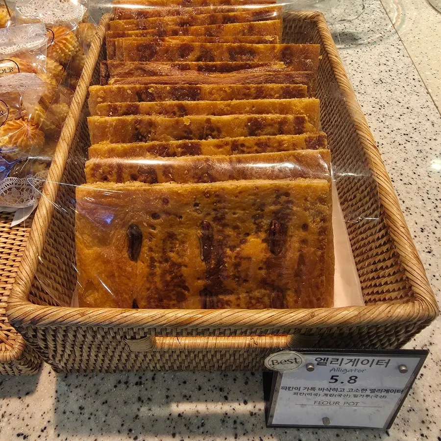 Bakery case with some bread sold out by evening