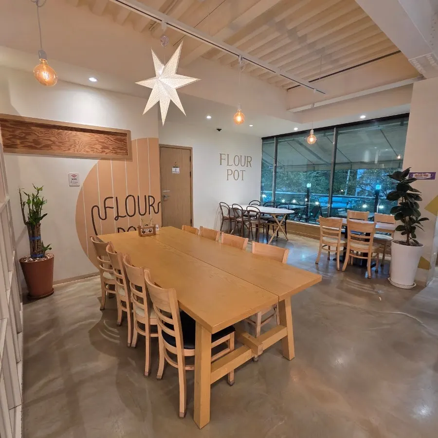 Seating area with long tables on the second floor