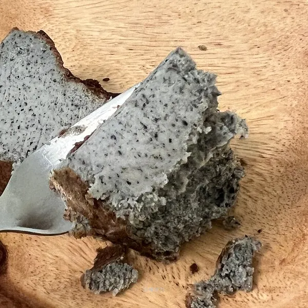 A slice of black sesame Basque cheesecake