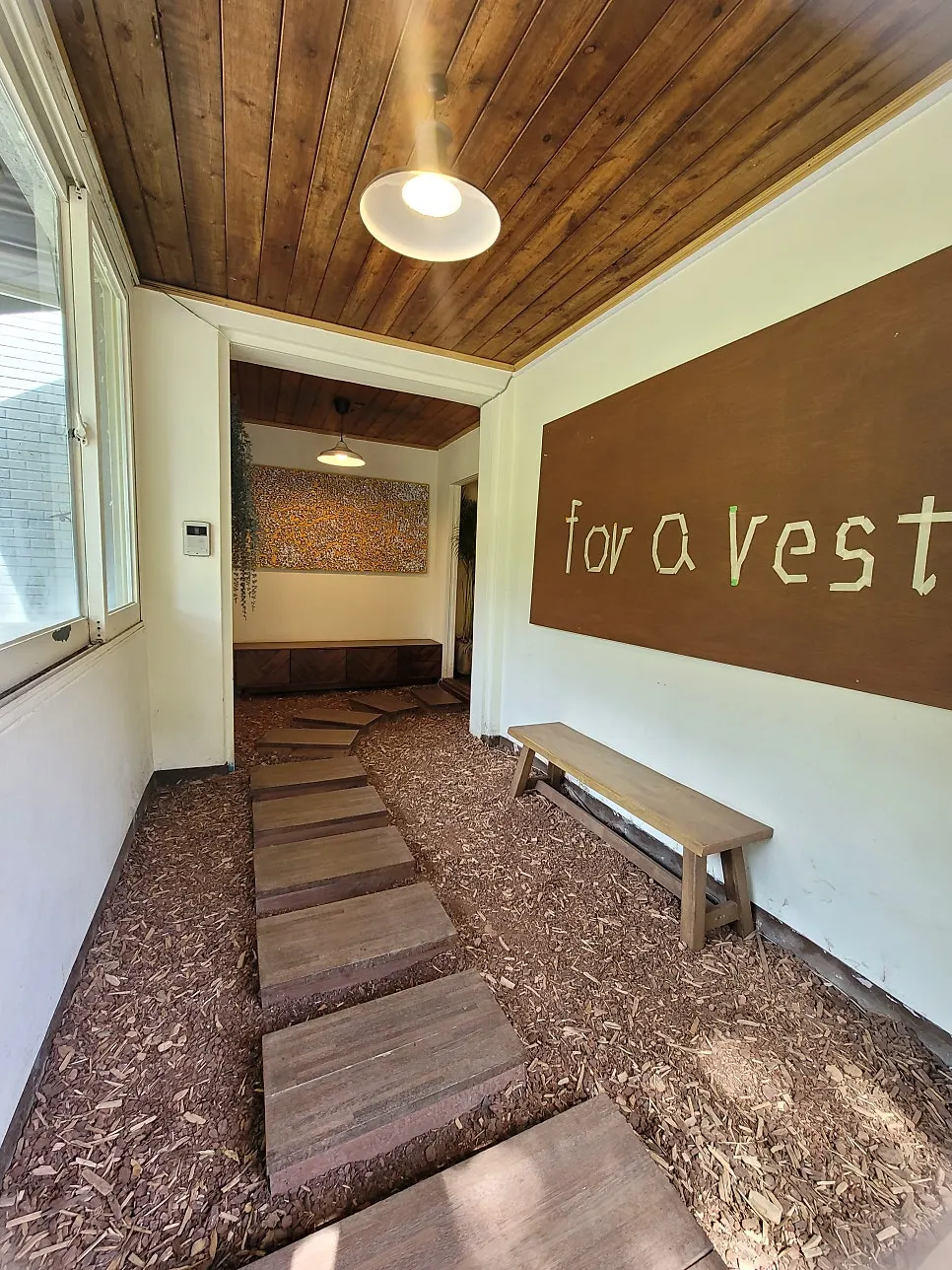 Entrance with Forerest's wood-tone standing sign