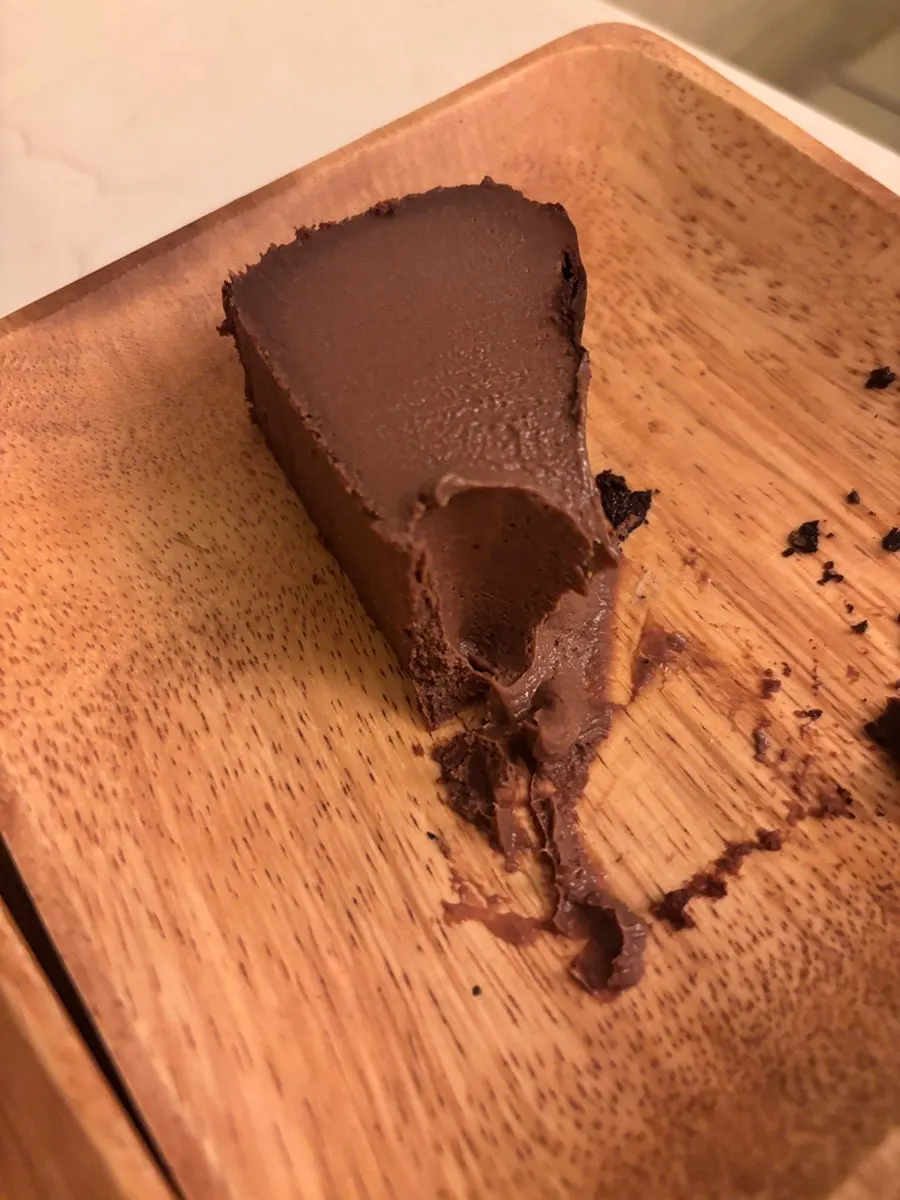 A rich bite-sized portion of the chocolate Basque cheesecake