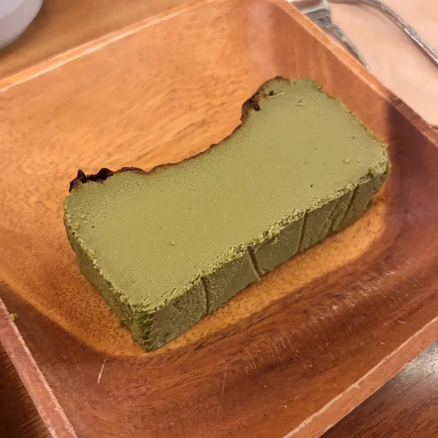 A slice of matcha Basque cheesecake