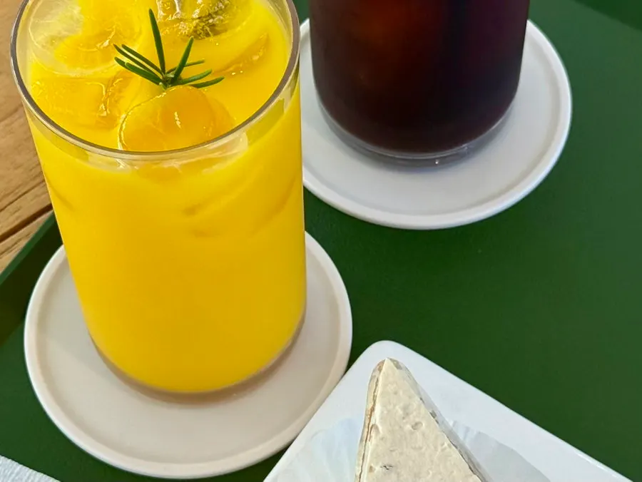 Table setting with americano and Jeju hallabong juice