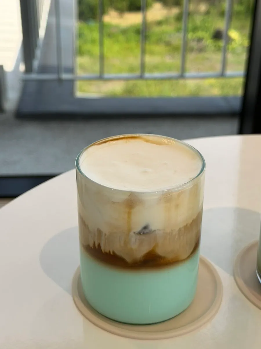 Jeongbang Waterfall Latte with a pistachio base layer