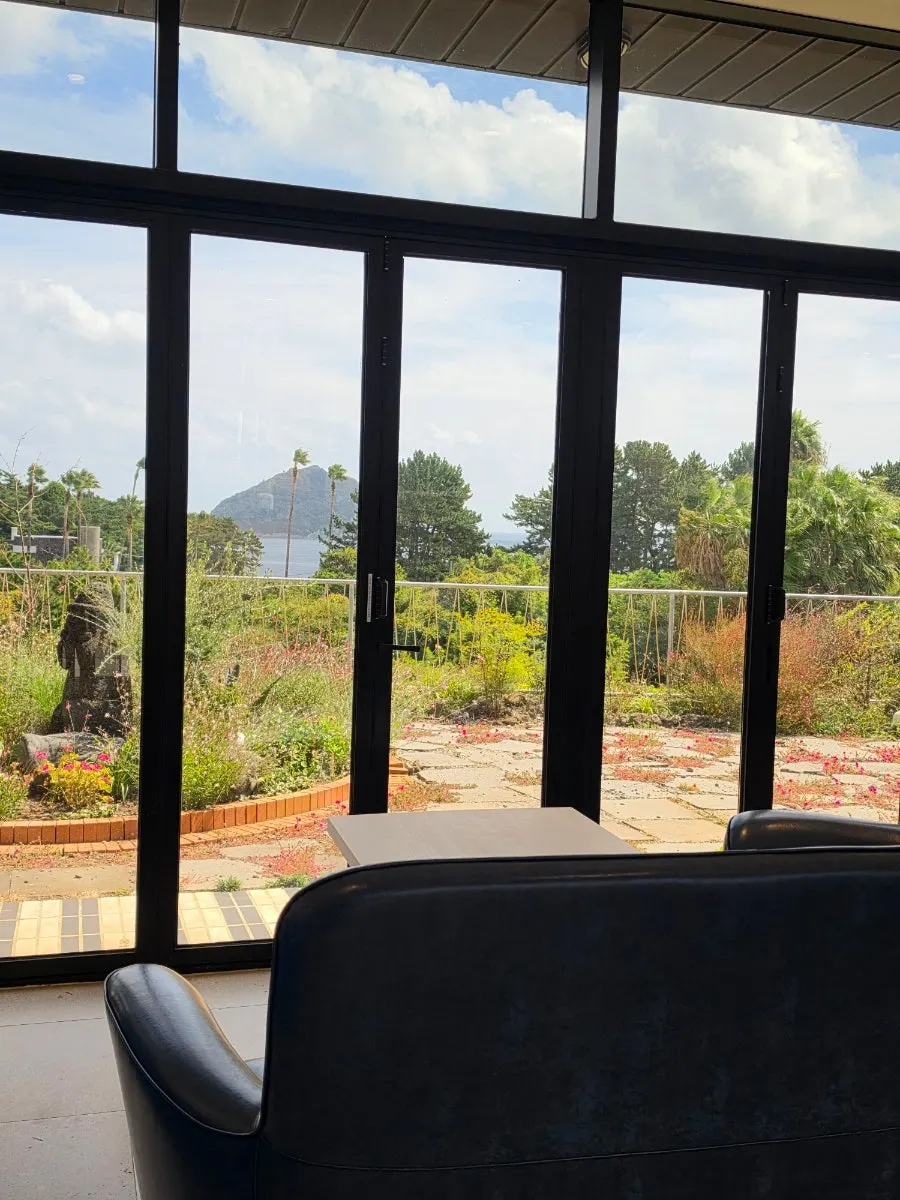 1st floor seating with garden view through picture windows