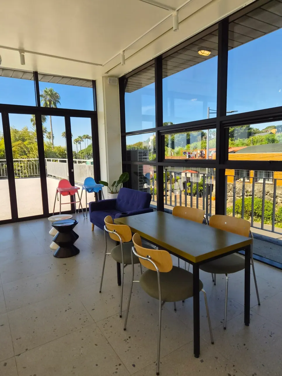 Second-floor ocean-view seating and floor-to-ceiling windows