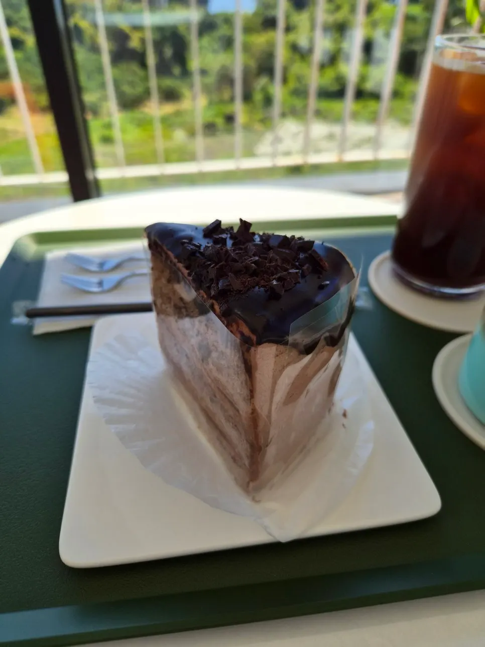 Valrhona choco cake served with an iced americano
