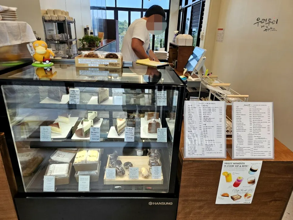 Interior of the Forest Jeongbang café counter with desserts on display