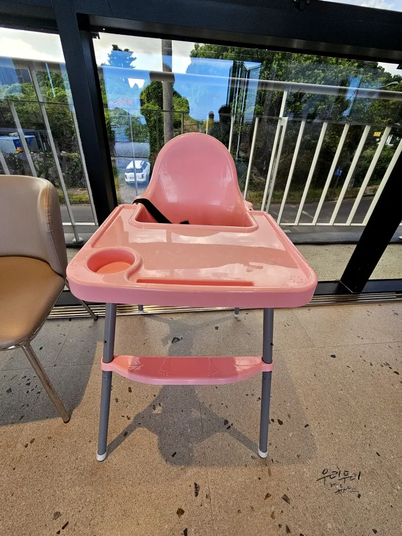 A baby chair set up in the hall